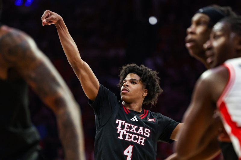 Feb 14, 2026; Tucson, Arizona, USA; Texas Tech Red Raiders guard Christian Anderson (4) scores a three-point basket during the first half of the game against the Arizona Wildcats at McKale Memorial Center. Mandatory Credit: Aryanna Frank-Imagn Images