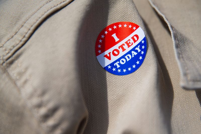 Matt Stevens displays his voting sticker outside of Hamlin Middle School in Corpus Christi, Texas, on Feb. 17, 2026.