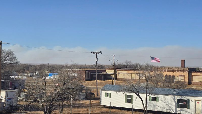 Smoke from the wildfire reported in the Potter/Oldham County area is seen near Amarillo Bouvelard and Florida Street in Amarillo during critical fire weather Tuesday, Feb. 17.