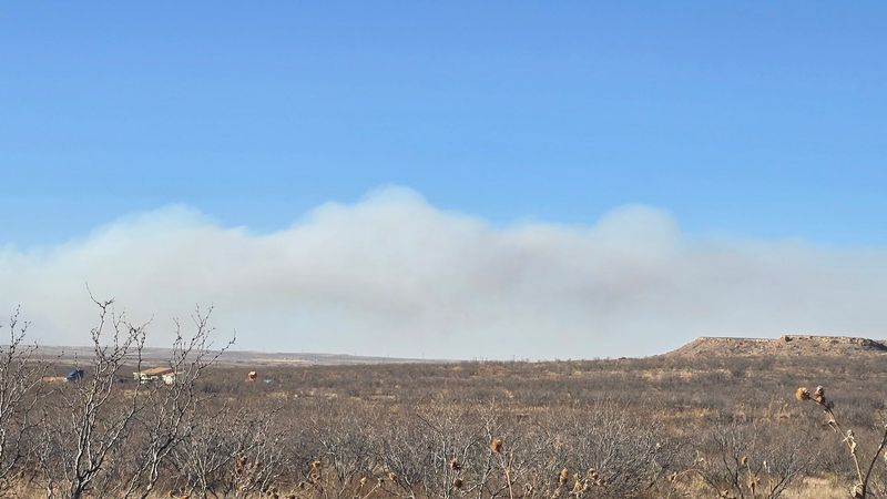 Smoke from the wildfire reported in the Potter/Oldham County area is seen at Hester and Cliffside Road in north Amarillo during critical fire weather Tuesday, Feb. 17.