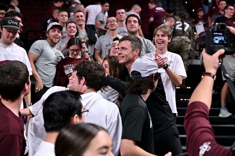 Feb 18, 2026; College Station, Texas, USA; Texas A&M Aggies head coach Bucky McMillan greets fans after the game against the Ole Miss Rebels at Reed Arena. Mandatory Credit: Maria Lysaker-Imagn Images