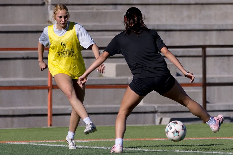 El Paso High soccer player Kylie Alvarez, left, faces a defender during practice Wednesday, Feb. 19, 2026, at El Paso High School in El Paso, Texas.