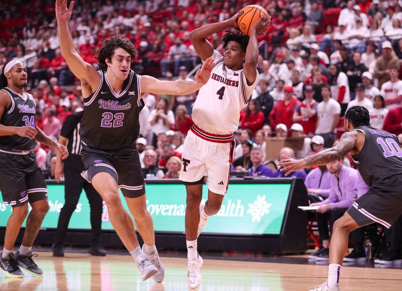 Texas Tech's Christian Anderson looks to pass against Kansas State during a Big 12 Conference men's basketball game, Saturday, Feb. 21, 2026, in United Supermarkets Arena.