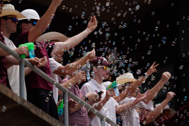 Jun 11, 2022; College Station, TX, USA; Fans cheer during the third inning of the Super Regional series between the Texas A&M Louisville at Blue Bell Park. Mandatory Credit: Chris Jones-USA TODAY Sports