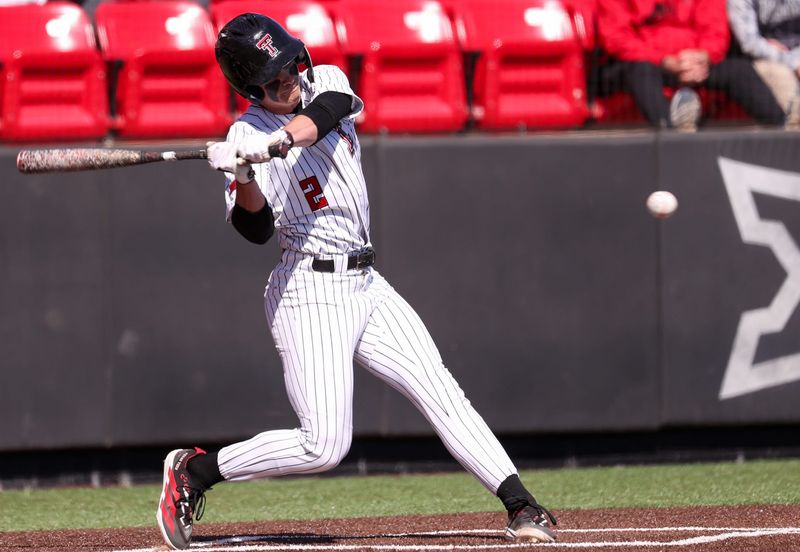 Texas Tech's Kyeler Thompson swings at a pitch against UAlbany during a non-conference baseball game, Sunday, Feb. 22, 2026, at Rip Griffin Park.
