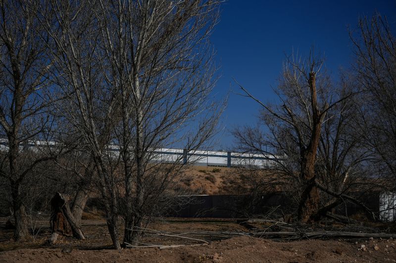 Warehouses proposed as migrant detention centers are visible from a neighborhood to the south in unincorporated El Paso County on Wednesday, Feb. 19, 2026. The Department of Homeland Security recently purchased three warehouse buildings totaling more than 826,000 square feet in nearby Socorro for $122.8 million as part of a national effort to convert large industrial sites into immigration detention centers, a process that has drawn local concern due to the lack of prior notice and the potential strain on city infrastructure.