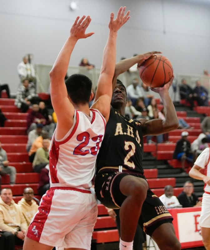 Andress' Toraino Johnson Jr. (2) drives to the basket as Bel Air's Angel Dominguez (23) applies tight defense during the second half of their playoff game at Bel Air High on Feb. 23, 2026. Andress won the game and advances in the postseason.