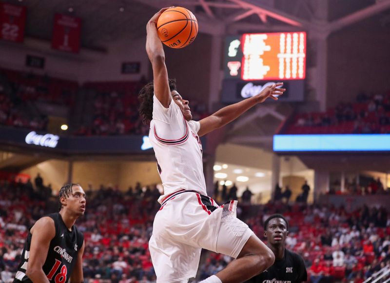 Texas Tech's Christian Anderson rises for a dunk against Cincinnati during a Big 12 Conference men's basketball game, Tuesday, Feb. 24, 2026, in United Supermarkets Arena.