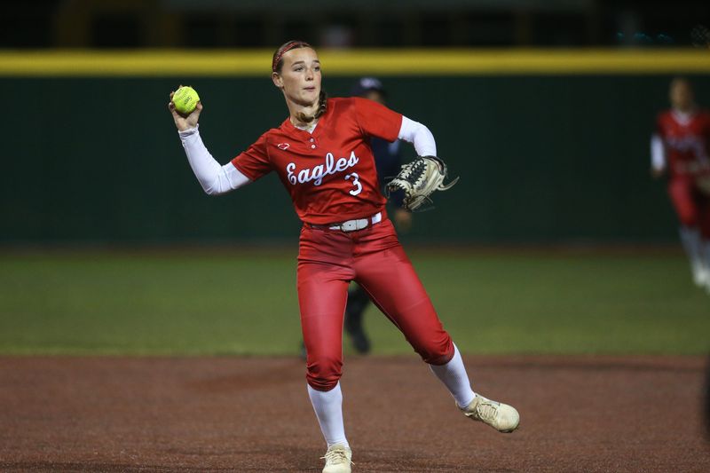Veterans Memorial's Parker Malone throws to first during a District 29-5A softball game against Flour Bluff at Cabaniss Softball Field on Tuesday, Feb. 24, 2026.