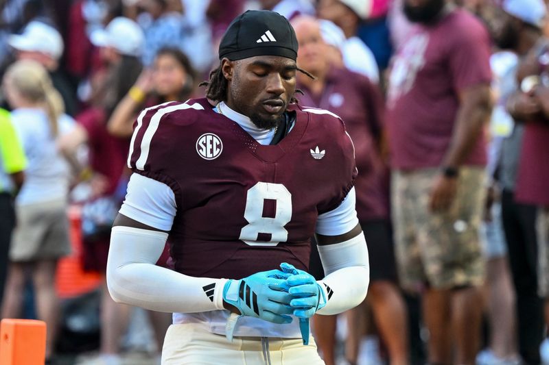 Oct 11, 2025; College Station, Texas, USA; Texas A&M Aggies running back Le'Veon Moss (8) takes a moment prior to the game against the Florida Gators at Kyle Field. Mandatory Credit: Maria Lysaker-Imagn Images