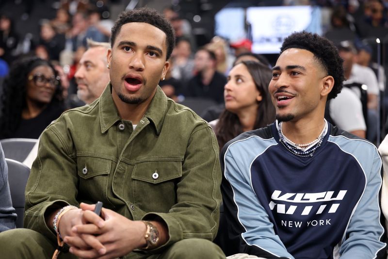 Feb 26, 2026; Inglewood, California, USA; C.J. Stroud (left) and Bryce Young (right) attend an NBA game between the Los Angeles Clippers and the Minnesota Timberwolves at Intuit Dome. Mandatory Credit: Kiyoshi Mio-Imagn Images
