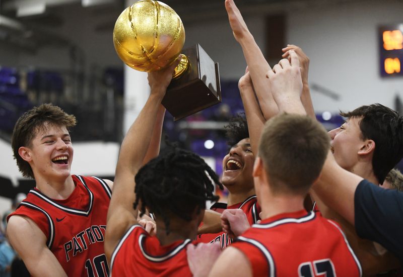 Lubbock-Cooper Liberty celebrates with its trophy after a win over Krum in a Class 4A Division II area-round playoff boys basketball game Friday, Feb. 27, 2026, at Bulldog Gym in Abilene.