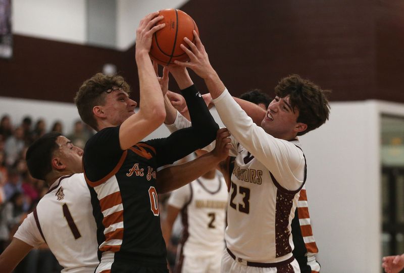 Beeville's Brayden Martorell and Tuloso-Midway's Nathan Avalos battle for a rebound during a Class 4A Division I boys basketball playoff game at Sinton on Feb. 27, 2026.