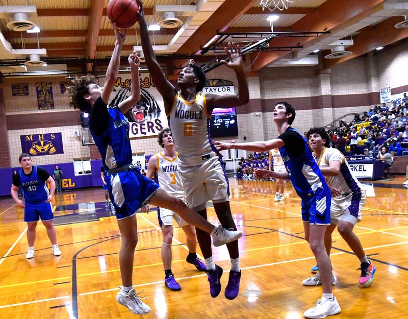 Westbrook’s Caiden Terry gets his shot blocked by Munday’s Jarvis Williams during playoff basketball in Merkel Friday Feb. 27, 2026. Final score was 56-33, Munday.