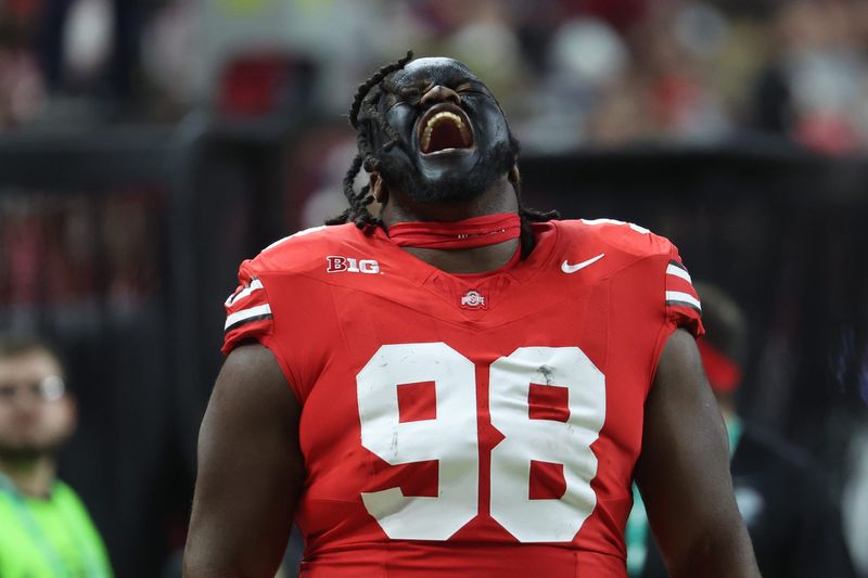 Dec 6, 2025; Indianapolis, IN, USA; Ohio State Buckeyes defensive lineman Kayden McDonald (98) reacts before the 2025 Big Ten championship game against the Indiana Hoosiers at Lucas Oil Stadium. Mandatory Credit: Trevor Ruszkowski-Imagn Images