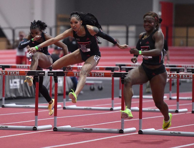Texas Tech’s Symoria Adkins, center, and Texas Tech’s Tonie-Ann Forbes compete in the 60-meter hurdles during the Big 12 indoor track and field championship, Saturday, Feb. 28, 2026, at the Sports Performance Center.