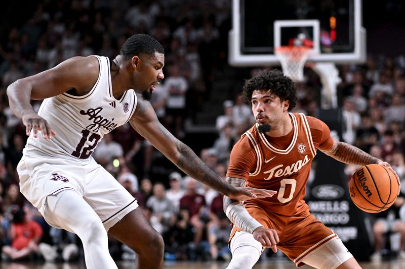 Feb 28, 2026; College Station, Texas, USA; Texas Longhorns guard Jordan Pope (0) drives against Texas A&M Aggies forward Rashaun Agee (12) during the first half at Reed Arena. Mandatory Credit: Maria Lysaker-Imagn Images