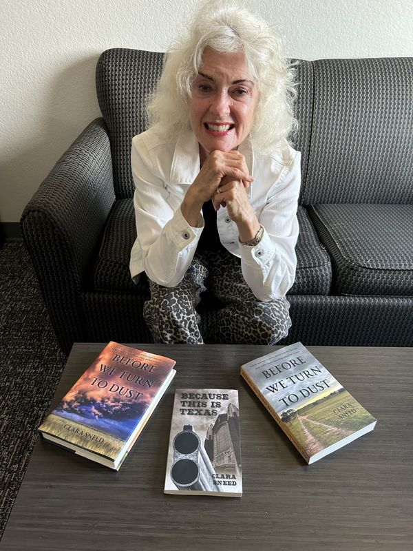 Texas author Clara Sneed on an earlier visit to Amarillo with her books about a famous Amarillo feud between two well-known families. She will be at WTAMU March 4 to deliver a lecture on writing history with imagination.