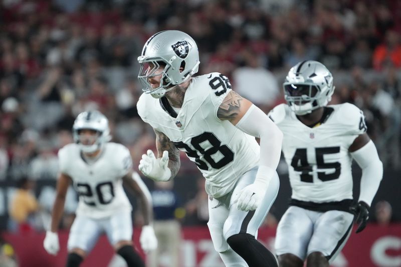Aug 23, 2025; Glendale, Arizona, USA; Las Vegas Raiders defensive end Maxx Crosby (98) pursues the play against the Arizona Cardinals during the first half at State Farm Stadium. Mandatory Credit: Joe Camporeale-Imagn Images