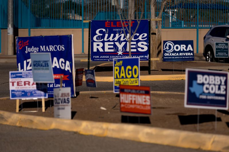 Campaign signs sit outside the Officer David Ortiz Recreation Center polling site during the 2026 Texas Primary Election on Tuesday, March 3, 2026, in El Paso.
