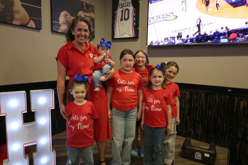 Holly Jeffreys stands with her young supporters, her grandkids and a friend, during her Texas House District 86 race watch party at Beef O'Brady's Tuesday evening, March 3.