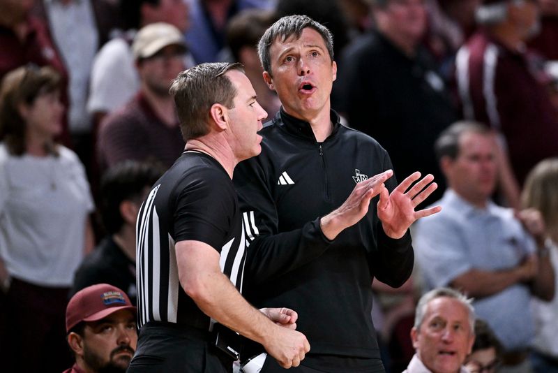 Mar 3, 2026; College Station, Texas, USA; Texas A&M Aggies head coach Bucky McMillan speaks with a referee during the second half against the Kentucky Wildcats at Reed Arena. Mandatory Credit: Maria Lysaker-Imagn Images