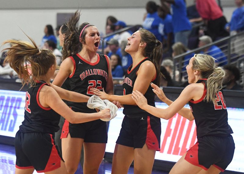 Shallowater's Kamryn Ledbetter (22) celebrates during a timeout after drawing a charge against Emory Rains in a Class 3A Division I state semifinal girls basketball game Tuesday, March 3, 2026, at Moody Coliseum in Abilene.