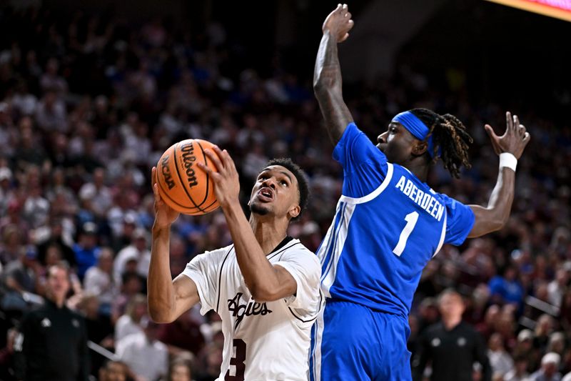 Mar 3, 2026; College Station, Texas, USA; Texas A&M Aggies guard Rylan Griffen (3) goes to the basket as Kentucky Wildcats guard Denzel Aberdeen (1) attempts to defend during the second half at Reed Arena. Mandatory Credit: Maria Lysaker-Imagn Images