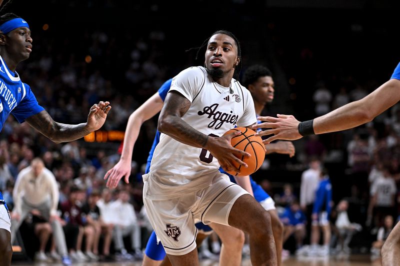 Mar 3, 2026; College Station, Texas, USA; Texas A&M Aggies guard Marcus Hill (0) drives against the Kentucky Wildcats during the second half at Reed Arena. Mandatory Credit: Maria Lysaker-Imagn Images