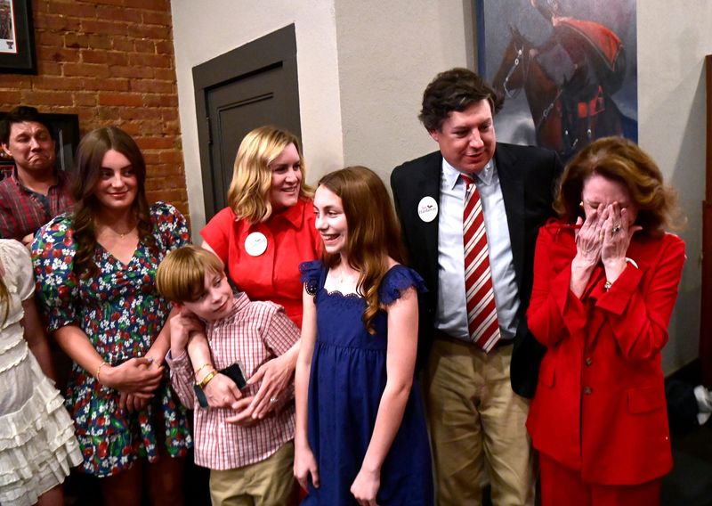 Jay Hardaway puts his arm around his mother Patti Jones as she momentarily sheds tears for his victory in the Republican primary election for state House District 71 State representative Tuesday.