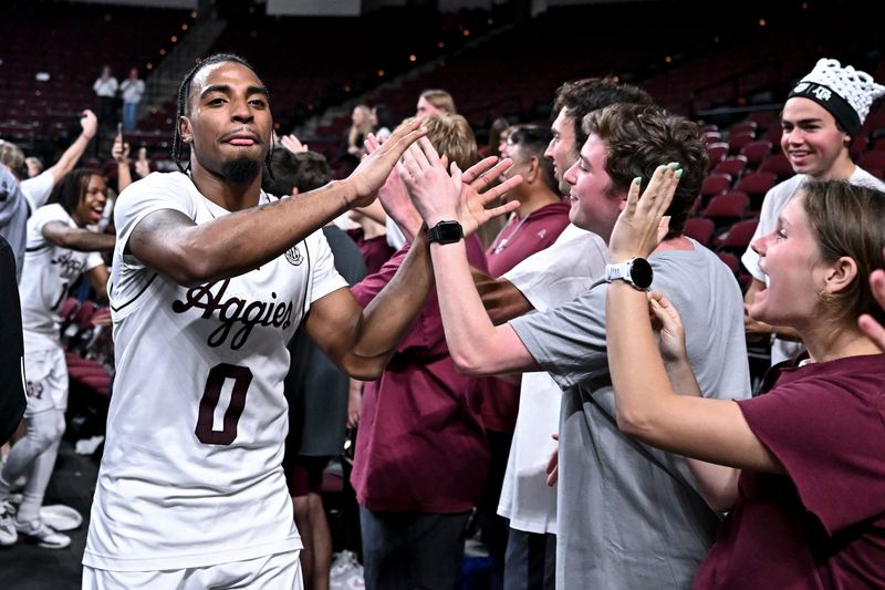 Mar 3, 2026; College Station, Texas, USA; Texas A&M Aggies guard Marcus Hill (0) high fives the students after the win over Kentucky Wildcats at Reed Arena. Mandatory Credit: Maria Lysaker-Imagn Images