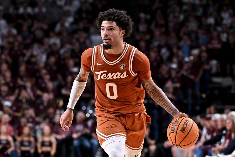 Feb 28, 2026; College Station, Texas, USA; Texas Longhorns guard Jordan Pope (0) dribbles the ball during the first half against the Texas A&M Aggies at Reed Arena. Mandatory Credit: Maria Lysaker-Imagn Images