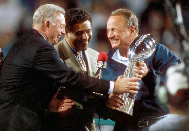Jan 28, 1996; Tempe, AZ, USA; FILE PHOTO; Dallas Cowboys owner JERRY JONES and head coach BARRY SWITZER receive the Super Bowl Trophy after their victory in Super Bowl XXX at Sun Devil Stadium. Mandatory Credit: Tony Tomsic-USA TODAY NETWORK