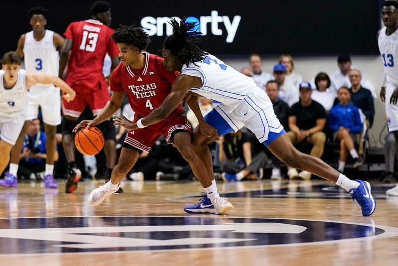 Mar 7, 2026; Provo, Utah, USA; BYU Cougars forward Khadim Mboup (7) defends Texas Tech Red Raiders guard Christian Anderson (4) during the first half at Marriott Center. Mandatory Credit: Aaron Baker-Imagn Images