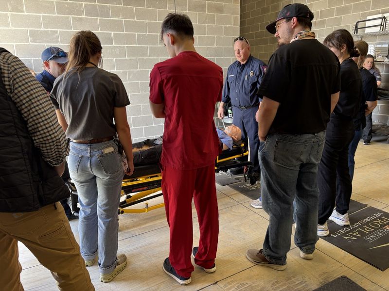 Students learn to move a wounded person to an ambulance during Disaster Day training, held at the Texas Tech University School of Veterinary Medicine, which included nursing and veterinarian students March 6.
