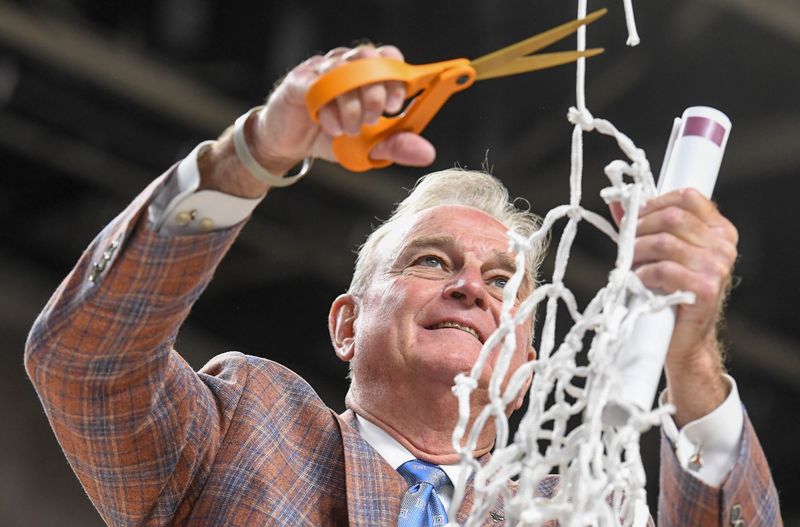 Texas Longhorns head coach Vic Schaefer cuts down the net Sunday, March 8, 2026, after the SEC Women's Basketball Tournament Championship game against the South Carolina Gamecocks at Bon Secours Wellness Arena in Greenville, South Carolina. Texas Longhorns won 78-61.