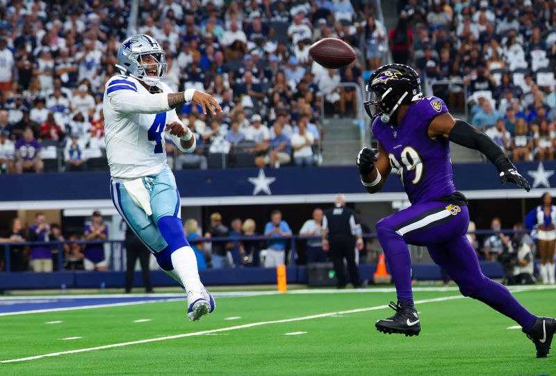Sep 22, 2024; Arlington, Texas, USA; Dallas Cowboys quarterback Dak Prescott (4) past Baltimore Ravens linebacker Odafe Oweh (99) during the first quarter at AT&T Stadium. Mandatory Credit: Kevin Jairaj-Imagn Images