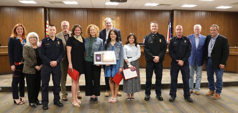 Teachers at Olsen Park Elementary helped put out a fire in a yard across the street from the school, saving loss of property and lives and were honored at the AISD meeting Monday evening with members of Amarillo Fire Department.