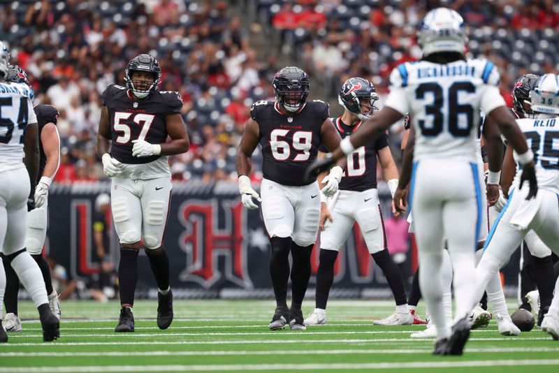 Aug 16, 2025; Houston, Texas, USA; Houston Texans offensive tackle Blake Fisher (57) and guard Ed Ingram (69) approach the line of scrimmage before a play during the game against the Carolina Panthers at NRG Stadium. Mandatory Credit: Troy Taormina-Imagn Images