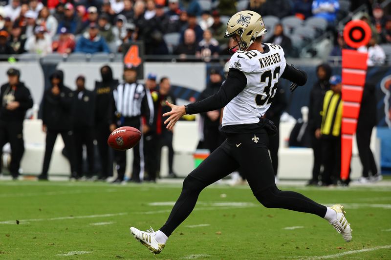 Oct 19, 2025; Chicago, Illinois, USA; New Orleans Saints punter Kai Kroeger (32) punts the ball to the Chicago Bears during the second half at Soldier Field. Mandatory Credit: Mike Dinovo-Imagn Images