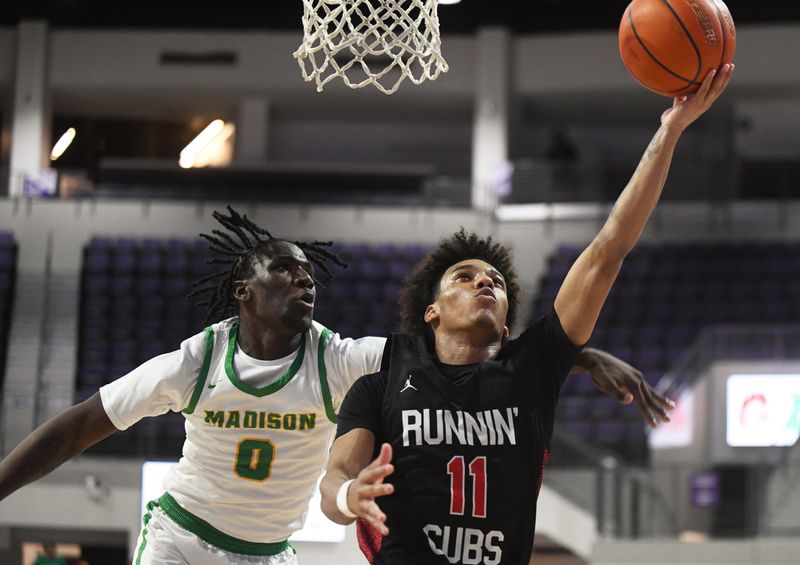 Brownfield's Trae Timmins shoots against Dallas Madison in a Class 3A Division I state semifinal boys basketball game Tuesday, March 10, 2026, at Moody Coliseum in Abilene.