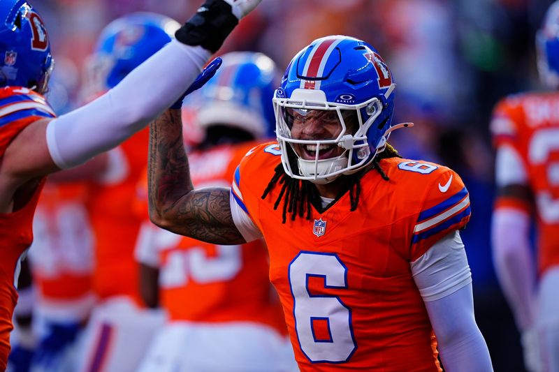 Jan 4, 2026; Denver, Colorado, USA; Denver Broncos safety P.J. Locke (6) smiles during the first half against the Los Angeles Chargers at Empower Field at Mile High. Mandatory Credit: Ron Chenoy-Imagn Images