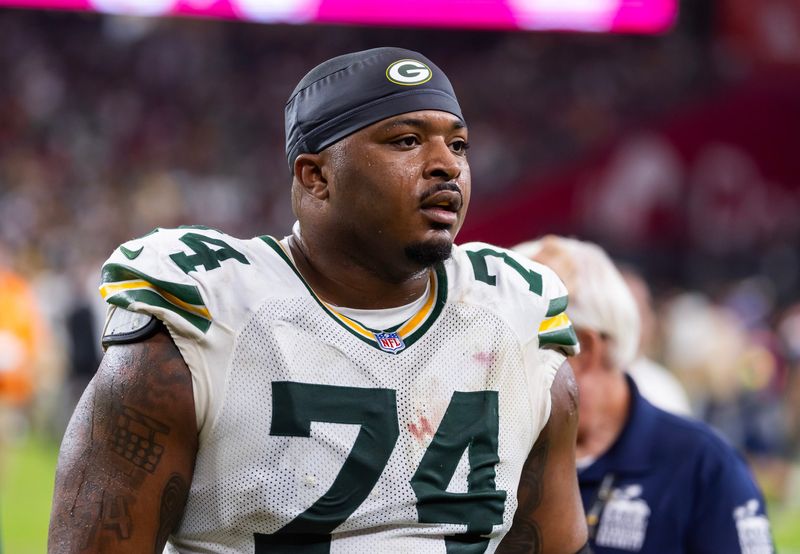 Oct 19, 2025; Glendale, Arizona, USA; Green Bay Packers center Elgton Jenkins (74) against the Arizona Cardinals at State Farm Stadium. Mandatory Credit: Mark J. Rebilas-Imagn Images