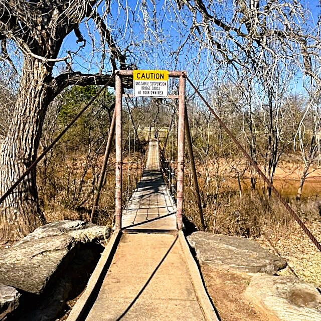 It's springtime at the Wichita River Bend RV Park footbridge entrance to Lucy Park, and today’s decision which way to go — left, right or forward?