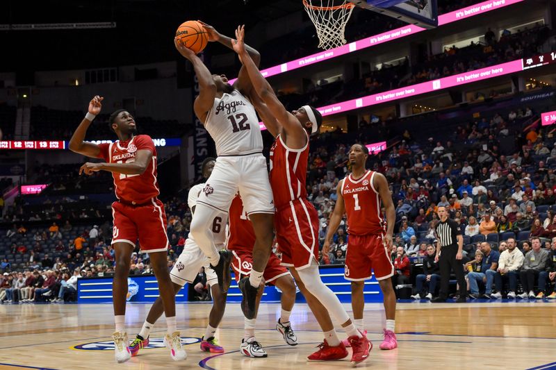 Mar 12, 2026; Nashville, TN, USA; Texas A&M Aggies forward Rashaun Agee (12) shoots over Oklahoma Sooners forward Mohamed Wague (5) during the first half at Bridgestone Arena. Mandatory Credit: Steve Roberts-Imagn Images