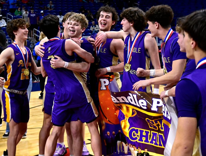 Members of the Panhandle Panthers congratulate Caden Armes after he was named Most Valuable Player the team’s win in the Class 2A Div. 1 basketball state championship against San Augustine in San Antonio Thursday March 12, 2026. Final score was 61-58, Panhandle.