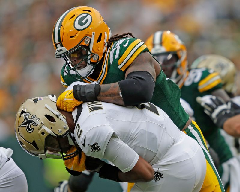 Green Bay Packers linebacker Rashan Gary (52) sacks New Orleans Saints quarterback Jameis Winston (2) during their football game Sunday, September 24, 2023, at Lambeau Field in Green Bay, Wis.