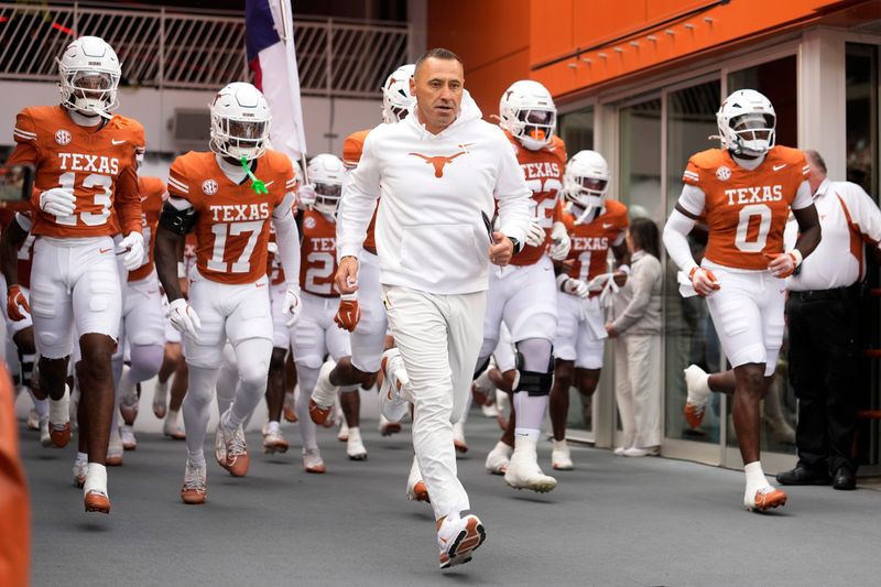 Nov 1, 2025; Austin, Texas, USA; Texas Longhorns head coach Steve Sarkisian leads his team on to the field before a game against the Vanderbilt Commodores at Darrell K Royal-Texas Memorial Stadium. Mandatory Credit: Scott Wachter-Imagn Images