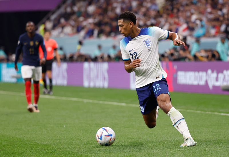 Dec 10, 2022; Al Khor, Qatar; England midfielder Jude Bellingham (22) dribbles during the first half of a quarterfinal game against France in the 2022 FIFA World Cup at Al-Bayt Stadium. Mandatory Credit: Yukihito Taguchi-USA TODAY Sports