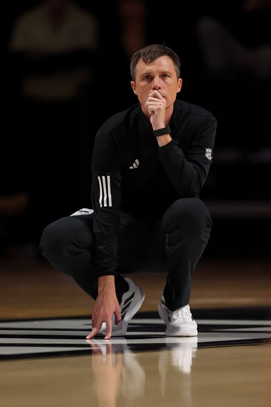 Feb 14, 2026; Nashville, Tennessee, USA; Texas A&M Aggies head coach Bucky McMillan watches his team against the Vanderbilt Commodores during the second half at Memorial Gymnasium. Mandatory Credit: Steve Roberts-Imagn Images